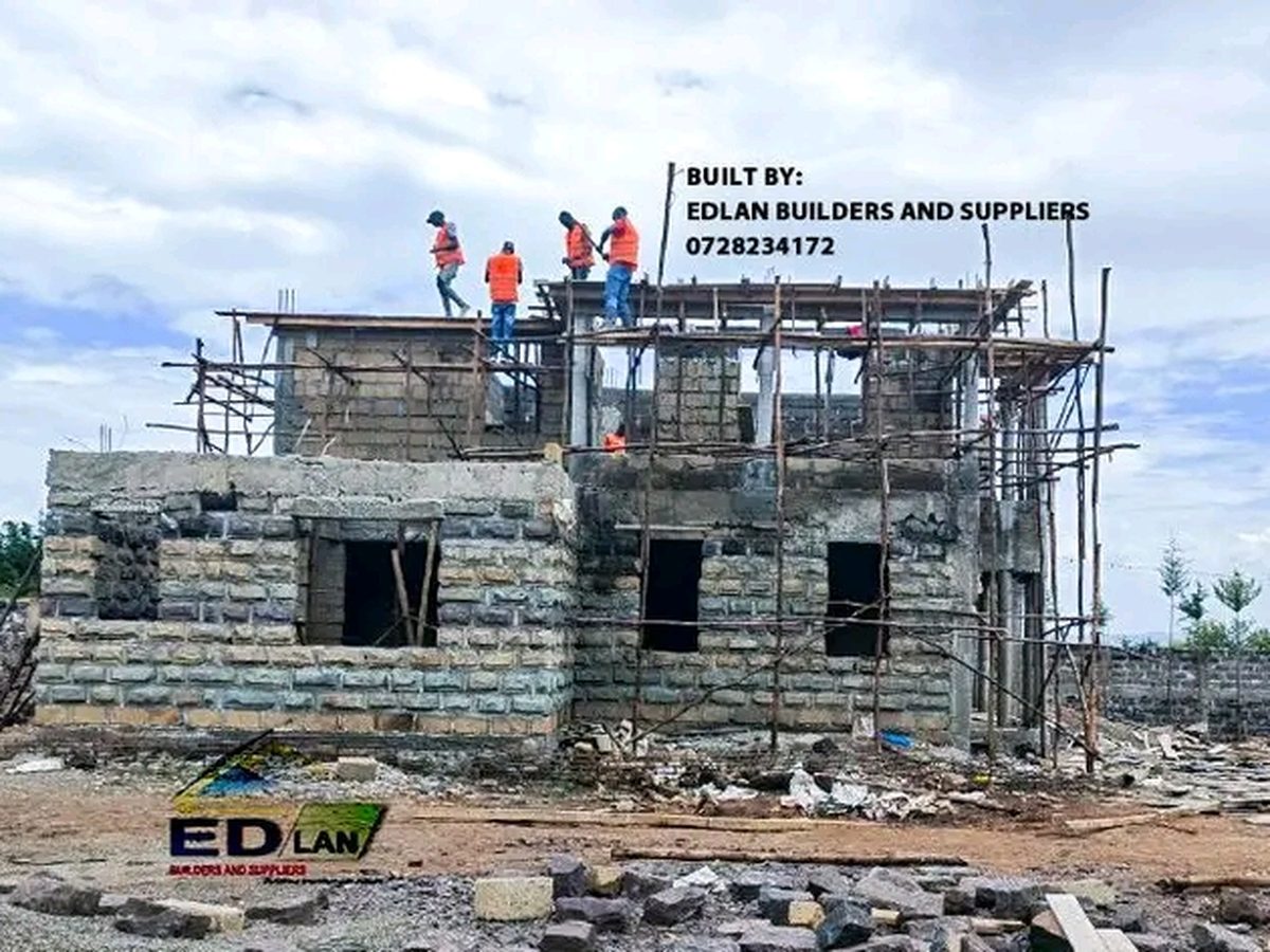 A two-storey house under construction with Edlan crew on the upper floor